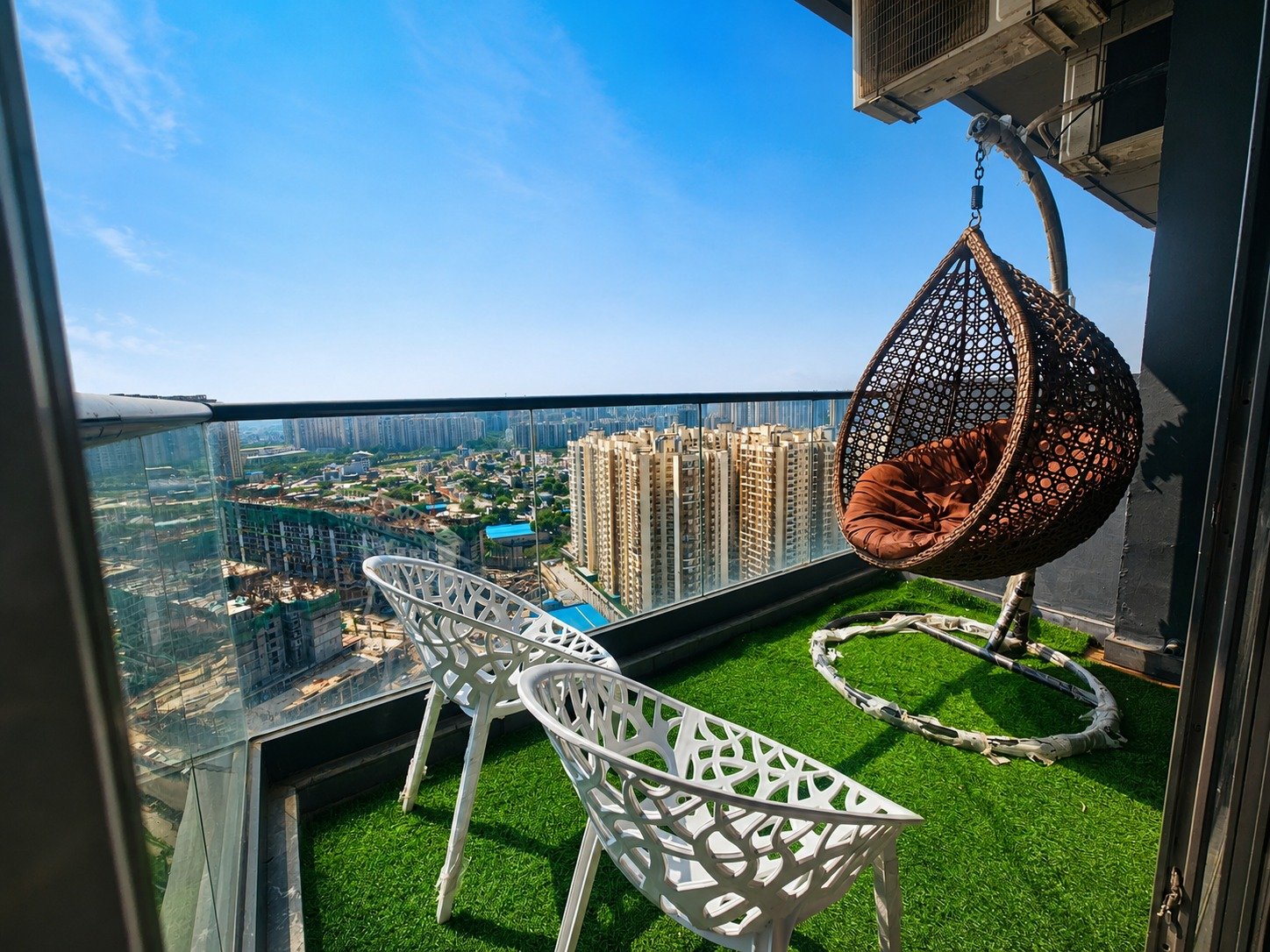 Sky balcony with swing chair and city view